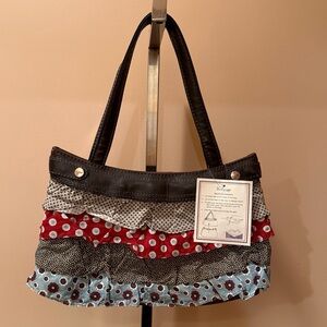 Thirty-One black skirt purse with ruffles